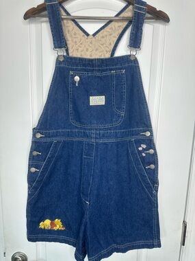 Vintage Disney Store Blue Denim Short Overalls with Winnie the Pooh Embroidery.
